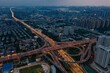 © Wirestock - Aerial view of Wuhan Optics Valley High tech Industrial Zone in China at night