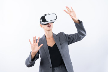 Project manager touching and managing system while using VR glasses. Caucasian business woman looking and planning strategy while standing and using visual reality headset. Technology. Contraption.