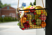 Assorted Artificial Fruits As Decor Element . Basket Filled With Artificial Fruits.  Close Up View