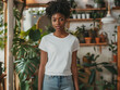 © VISUAL BACKGROUND - A young woman in a white t - shirt standing in dinning room.
