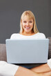 © peopleimages.com - Portrait, woman and laptop with studying, research in home for development or online course as student. Female person, excited and e learning with application for education in college or university