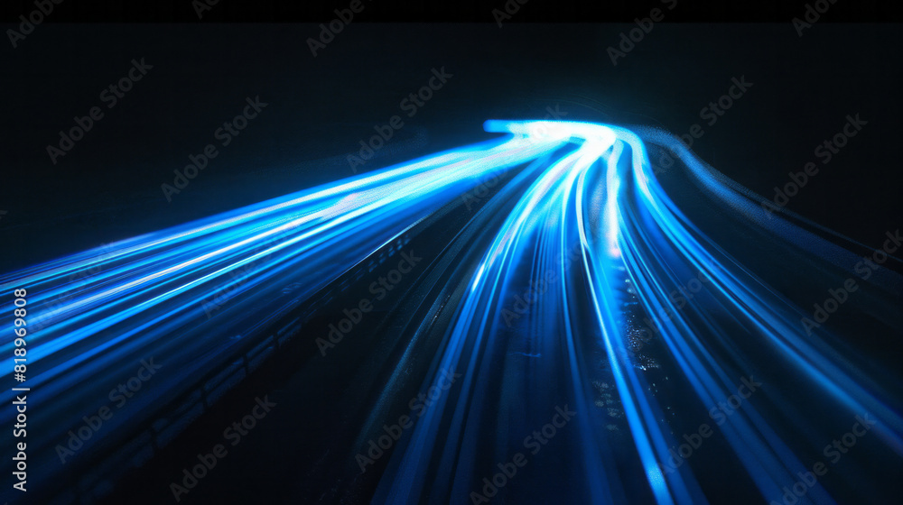 A streak of dynamic blue light trails across a pitch-black background ...