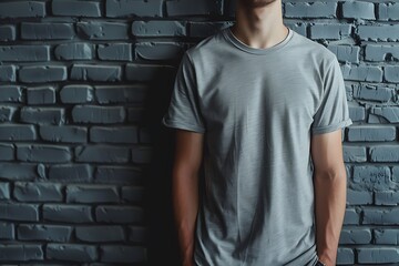 Gray t-shirt mockup at black brick wallpaper background.