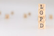 © PHalexaviles - LGPD letter. Concept of brazilian data protection law written on wooden cubes isolated on white background.