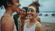 © 2B - Young latin man celebrating LGBTQ Pride Parade outdoors at the beach