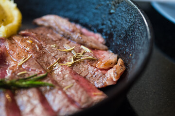 Wall Mural - Grilled sliced beef steak serving platter, recipe idea  medium rare