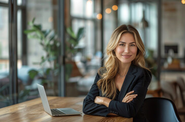 Business Woman Sitting at Table With Crossed Arms