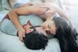 © peopleimages.com - Passion, love and couple in bed with kiss, romance and morning bonding in apartment. Relationship, man and woman in bedroom with intimate embrace, affection and relax with care on weekend in home