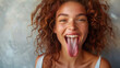© Glebstock - healthy tongue , healthy body idea. woman looking into the camera, mouth wide open sticking her tongue out