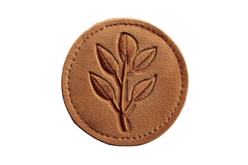 Round, brown leather patch with embossed leaf design. Perfect for crafts, DIY projects, and clothing accessories.