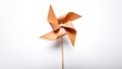 © Chase D’Animulls - pinwheel or windmill paper origami isolated on white background simple starter craft for kids for weekend entertainment. ESG and Clean Energy Concept. Wind Turbine Paper into the Sky. Decrease Carbon