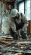 © augieloinne - Construction Worker in Protective Gear Demolishing Interior of Old Building