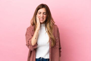 Caucasian woman isolated on pink background with toothache