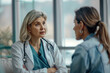 © barmaleeva - Female doctor talking to woman during medical appointment