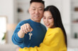 © New Africa - Happy couple with key in their new apartment, selective focus