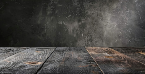 Wall Mural - Rustic wooden table with dark, weathered planks and textured grey background