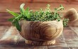 © father - Wooden mortar with overflowing fresh aromatic herbs.
