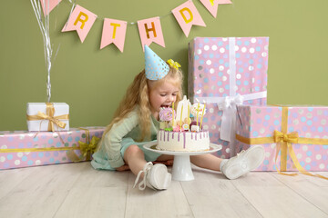 Sticker - Cute little girl in party hat with cake celebrating Birthday at home