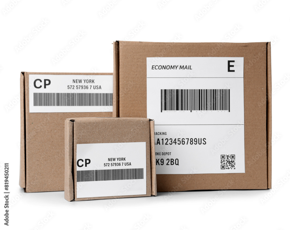 Cardboard packages with shipping labels and barcodes on white background