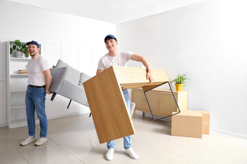 Wall Mural - Loaders carrying furniture in room