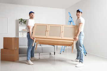 Wall Mural - Loaders carrying commode in room