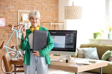 Sticker - Female graphic designer with tablet in office