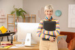 © Pixel-Shot - Female graphic designer with tablet in office