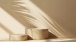 © horizon - Minimalist plain beige background for product presentation with two simple cylinder pedestal podiums and a shadow on the copy space.