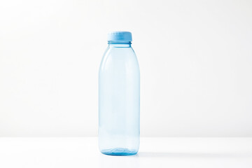 Wall Mural - Blue Plastic Water Bottle with Cap on White Background