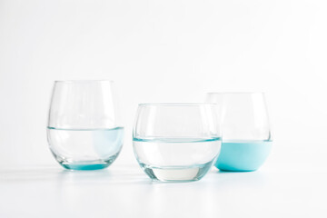 Sticker - Three Glasses of Water on a White Background