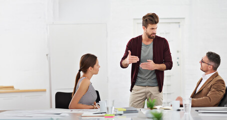 Wall Mural - Meeting, teamwork and business people in office for discussion on creative project together. Conversation, planning and group of professional designers working in collaboration in workplace boardroom