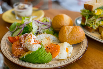 Canvas Print - Avocado with smoked salmon salad at coffee shop