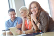 © peopleimages.com - Business, meeting and mature woman in office for collaboration, synergy or conference. Professional, teamwork and happy female employee for communication, planning and discussion on project together