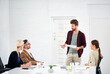 © peopleimages.com - Meeting, business people and speaker for discussion in office with annual report, startup update and progress. Career, corporate team and hr manager for training, coaching and explain with paper