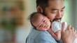 © Zunaira - An Indian father holding his newborn baby with copy space.
