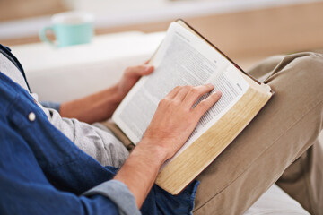 Person, hands and reading bible or scripture for Christianity religion for information, Jesus or belief. Worship, prayer and learning in home apartment or God education as praise, research or help