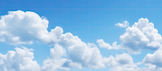 Poster - Beautiful cirrocumulus clouds against a clear blue sky ideal for use as a background wallpaper digital artwork and more with ample copy space image