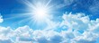 © Ilgun - Abstract background of blue sky and white clouds with the sun shining. Copy space image. Place for adding text and design