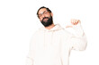 © luismolinero - Young man with beard over isolated chroma key background proud and self-satisfied