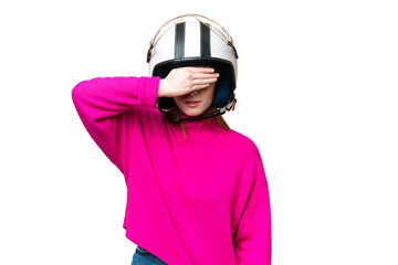 Sticker - Young pretty woman with a motorcycle helmet over isolated chroma key background covering eyes by hands. Do not want to see something