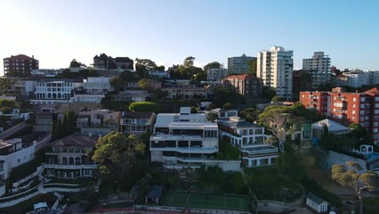 Wall Mural - Aerial drone view rising up over the harbour side suburb of Point Piper in East Sydney, NSW, Australia on a sunny morning in May 2024 