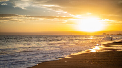 Wall Mural - Stunning sunset with a picturesque sky over Huntington Beach, California