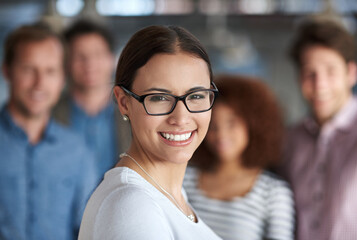 Fototapete - Portrait, manager and happy business woman in office for creative career, job and coworking with team in startup. Face, leader and smile of professional entrepreneur, editor or employee with glasses