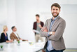 © peopleimages.com - Businessman, portrait and coworking workplace for creative job, happy employee and company goals with vision for growth. People, office and business meeting, project manager and happy male person