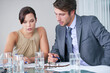 © peopleimages.com - Business, people and talking in office with paperwork, diversity employee and project report or discussion. Company, document and community or strategy planning, collaboration and staff in boardroom