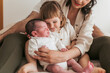 © ADDICTIVE STOCK - Family welcoming a newborn baby at home
