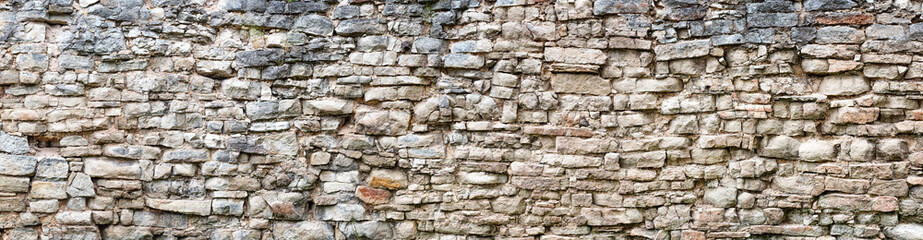 Wall Mural - antique stone wall, old stonework made of cobblestones and concrete