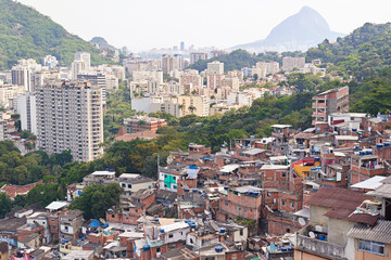 Wall Mural - Drone, city and building or housing development, architecture and informal infrastructure. Town, location and outdoor for tourism travel in aerial view, property and favelas settlement in Brazil