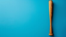 A Wooden Baseball Bat On A Blue Background. The Bat Is Old And Well-used, With A Dark Brown Color And A Few Scratches.