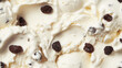 © icecreamparadice - top view of rum raisin ice cream surface, a closeup of the rum raisin ice cream texture, highlighting its creamy base with plump raisins and a hint of rum
